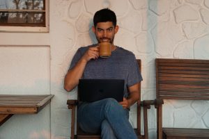 Dr Ryan Takagi Drinking Coffee in His Office in Tanzania